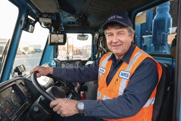 Mark Klistoff, Owner and President of WRS Inc., seated in the cab of a company truck